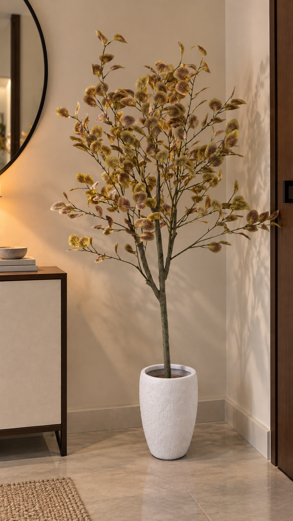 Decorative potted eucalyptus-style tree with tall stems and round textured pot