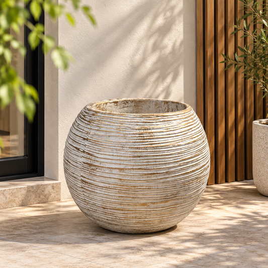 Light round fiber ball planter with horizontal ribbed stripes and wide opening