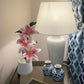 Pink and white lily bouquet in white textured pot